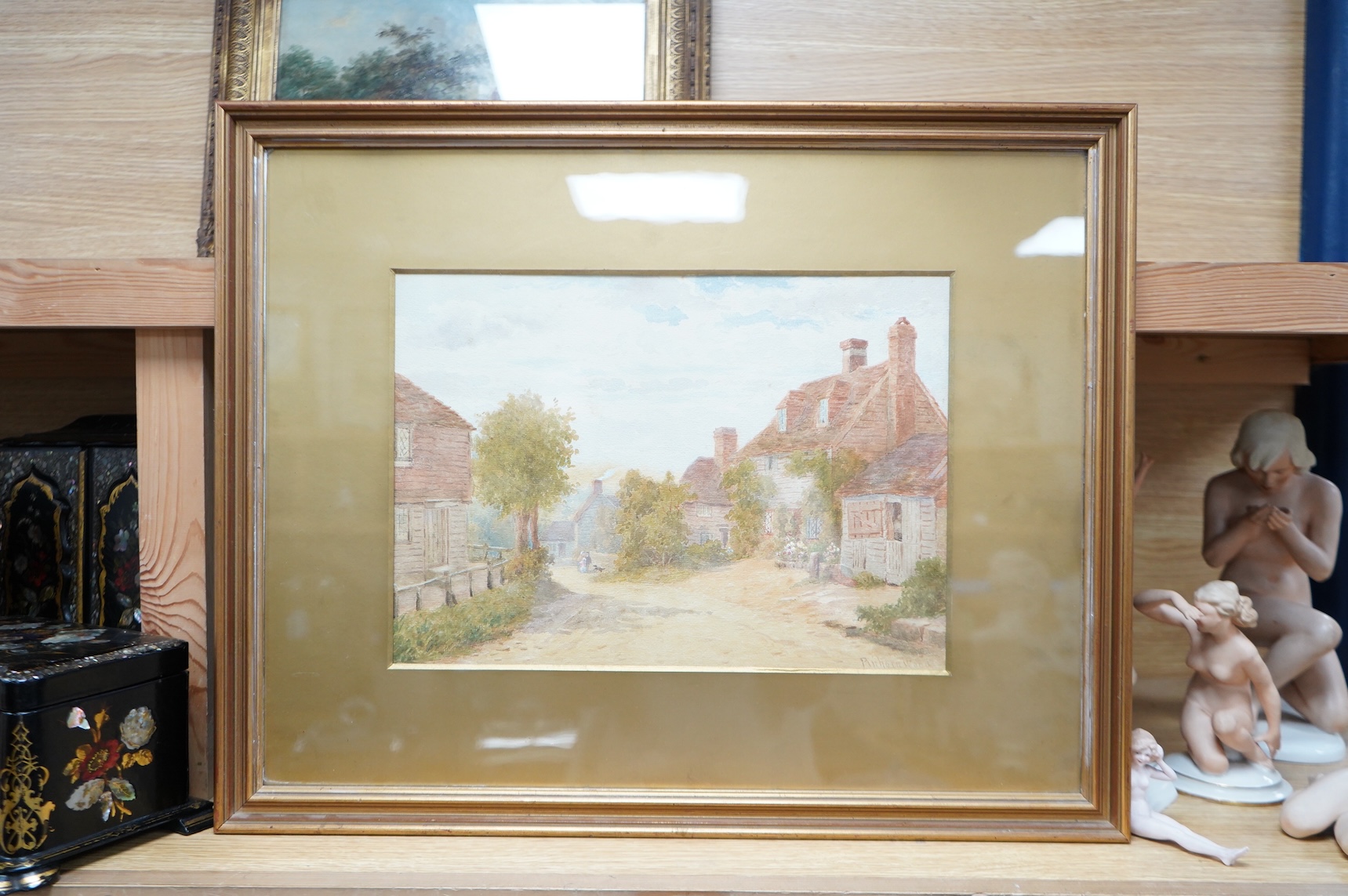 19th century, English School, Landscape with thatched cottage and stream, oil on canvas, gilt framed, together with a watercolour, Street scene, inscribed ‘Pinhorn Wood’, largest 24 x 34cm